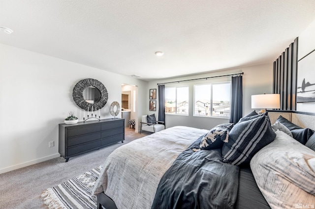 bedroom with visible vents, baseboards, and carpet