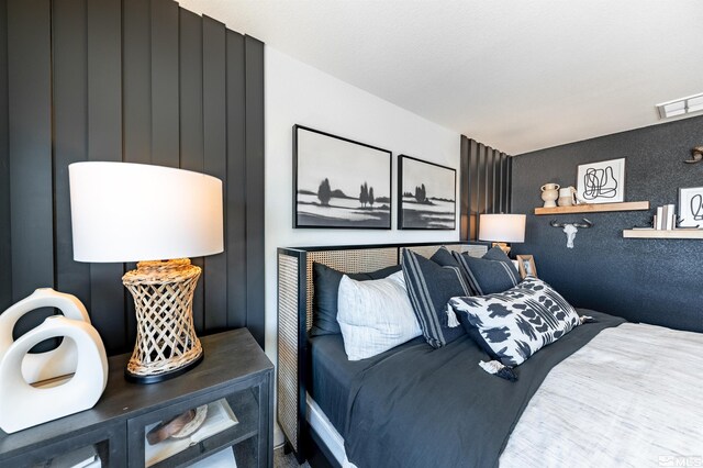 bedroom featuring visible vents