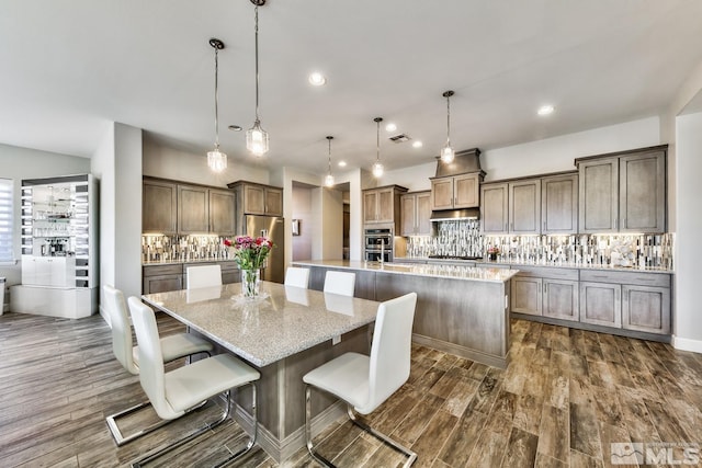 dining area featuring recessed lighting, dark wood-type flooring, and visible vents