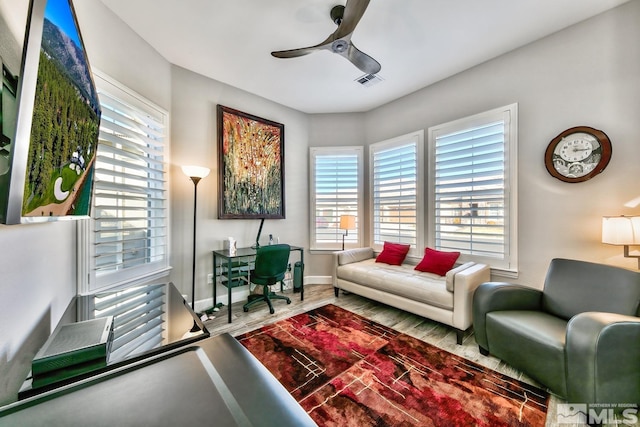 office area featuring visible vents, ceiling fan, baseboards, and plenty of natural light