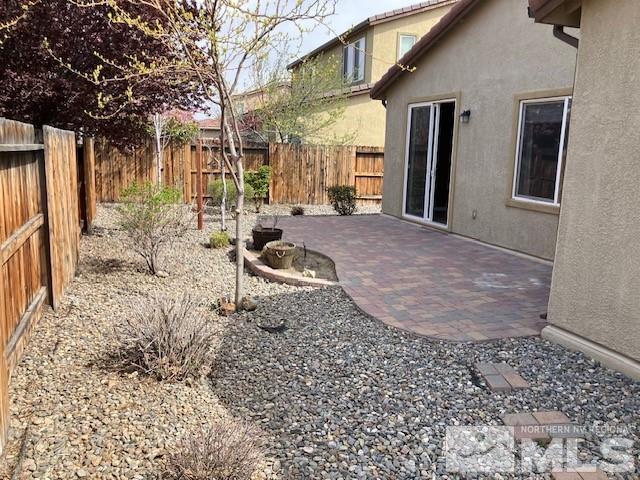 view of yard with a patio and a fenced backyard