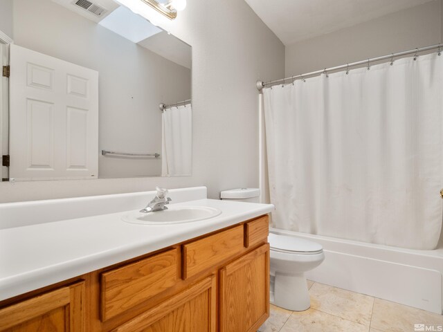 bathroom with vanity, shower / tub combo with curtain, tile patterned flooring, toilet, and visible vents