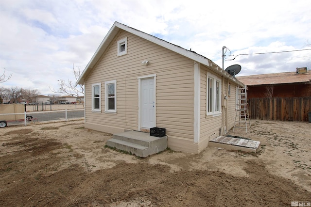 back of property with fence