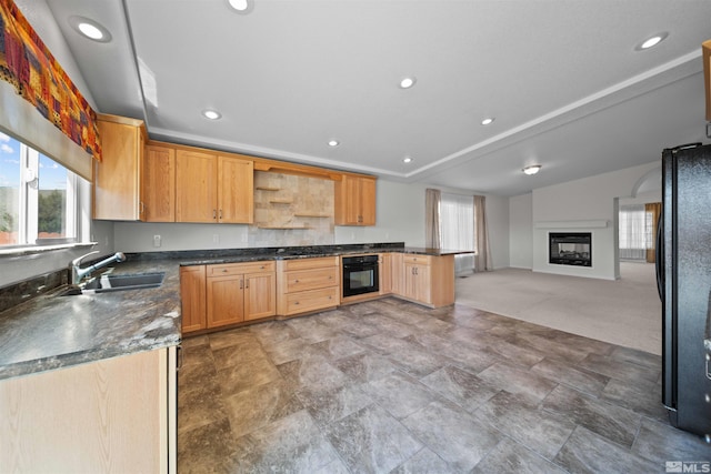 kitchen with open shelves, dark countertops, a wealth of natural light, and black appliances