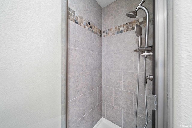 bathroom with a stall shower