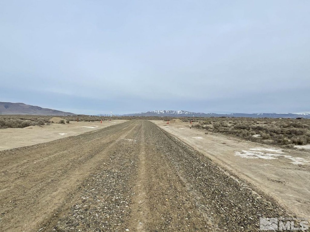 view of road featuring a rural view and a mountain view