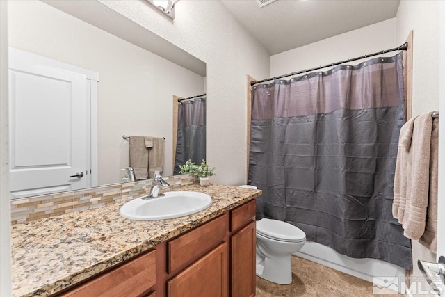 full bath featuring decorative backsplash, vanity, and toilet