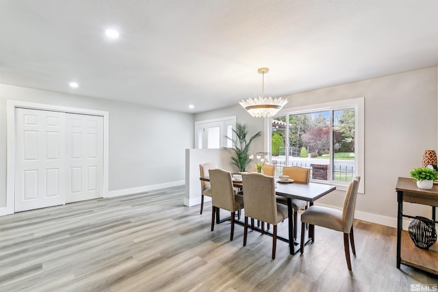 dining room featuring recessed lighting, baseboards, a healthy amount of sunlight, and light wood-type flooring