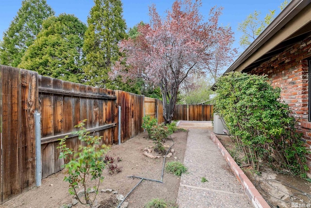view of yard with a fenced backyard