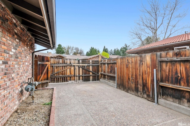 view of patio / terrace with a gate and fence