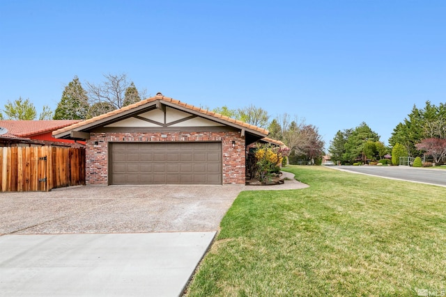 ranch-style home with concrete driveway, a front lawn, a tiled roof, an attached garage, and fence