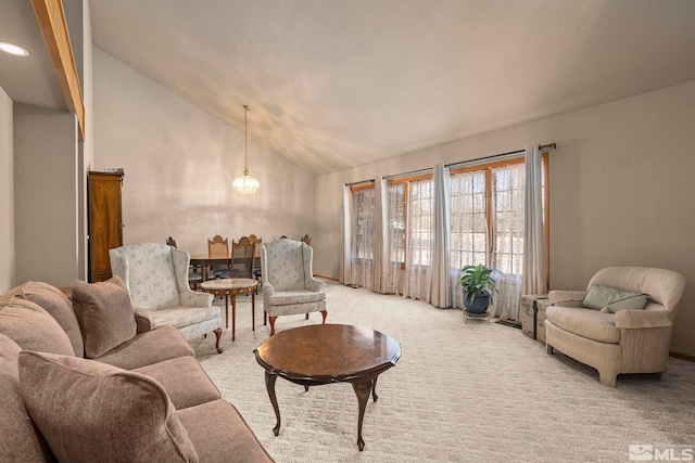 living room with light carpet and vaulted ceiling