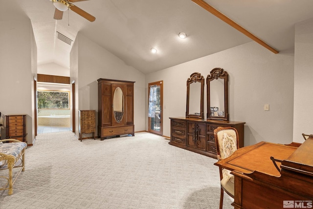 bedroom featuring ensuite bath, vaulted ceiling, visible vents, and light colored carpet