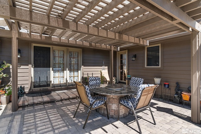 view of patio / terrace featuring a pergola and outdoor dining space