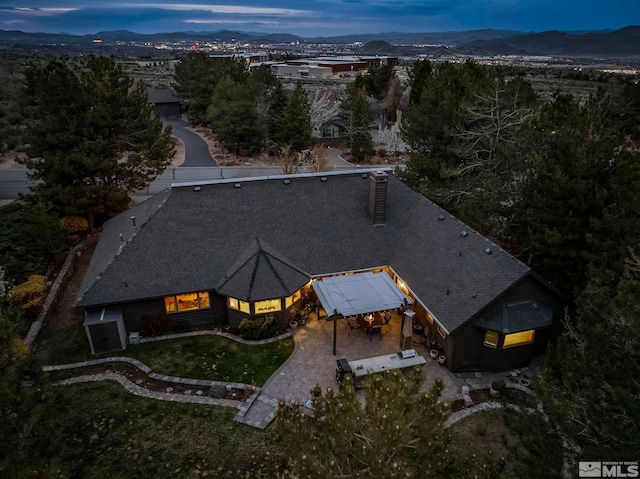 birds eye view of property featuring a mountain view