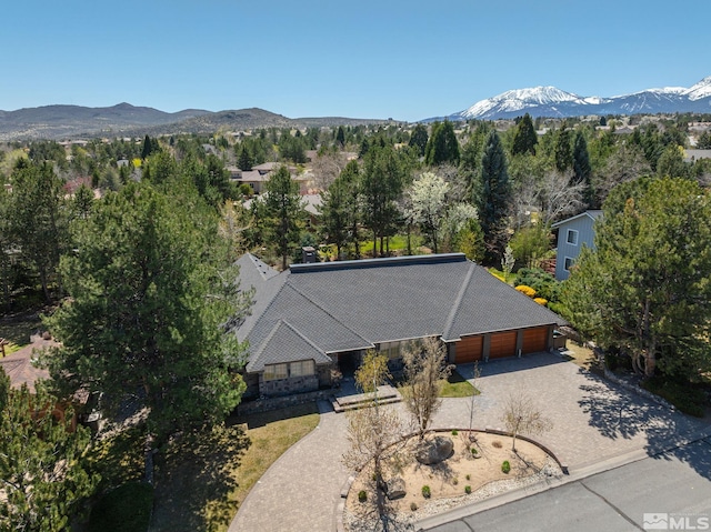 birds eye view of property with a mountain view