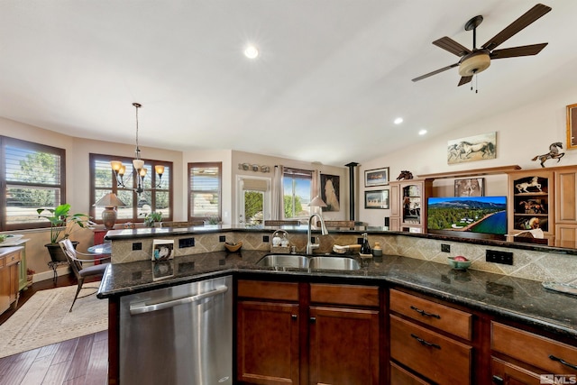 kitchen featuring tasteful backsplash, a sink, ceiling fan with notable chandelier, dishwasher, and recessed lighting