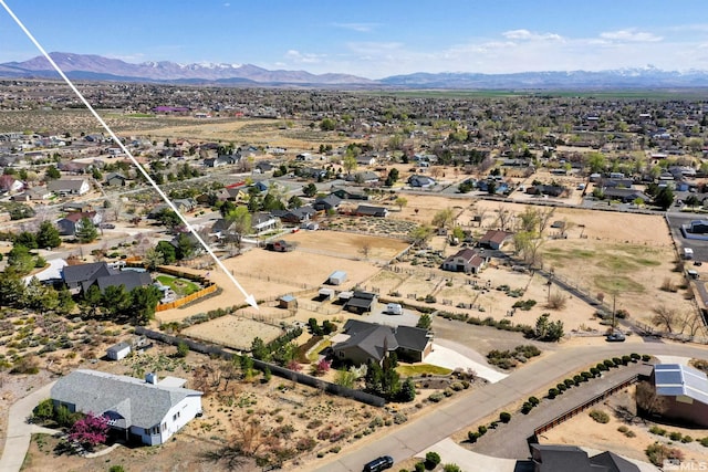 birds eye view of property with a residential view and a mountain view