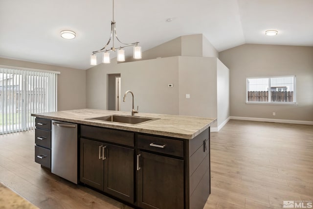 kitchen featuring light wood-style flooring, a sink, a healthy amount of sunlight, vaulted ceiling, and dishwasher