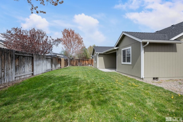 view of yard with a fenced backyard