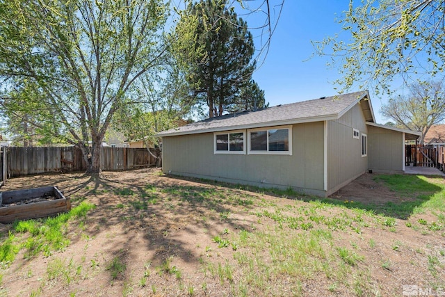 exterior space with a fenced backyard