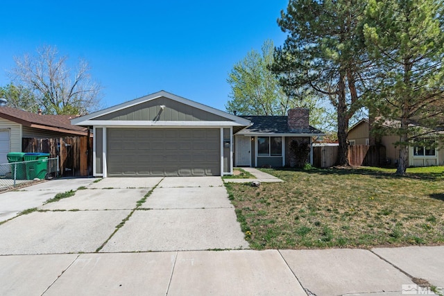 ranch-style house featuring a chimney, concrete driveway, fence, a garage, and a front yard