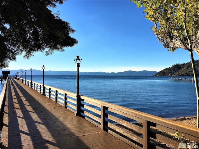 dock area featuring a water and mountain view