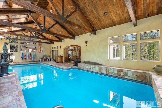 indoor pool featuring arched walkways