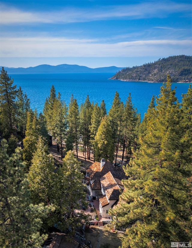 aerial view featuring a water and mountain view