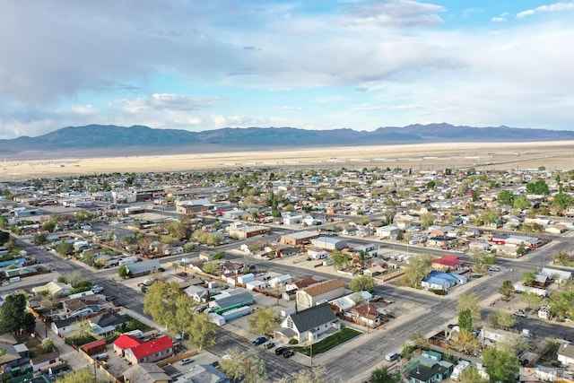 drone / aerial view featuring a residential view and a mountain view