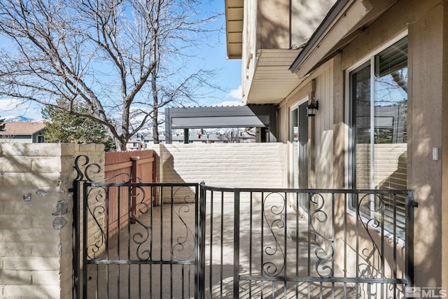 view of gate with fence