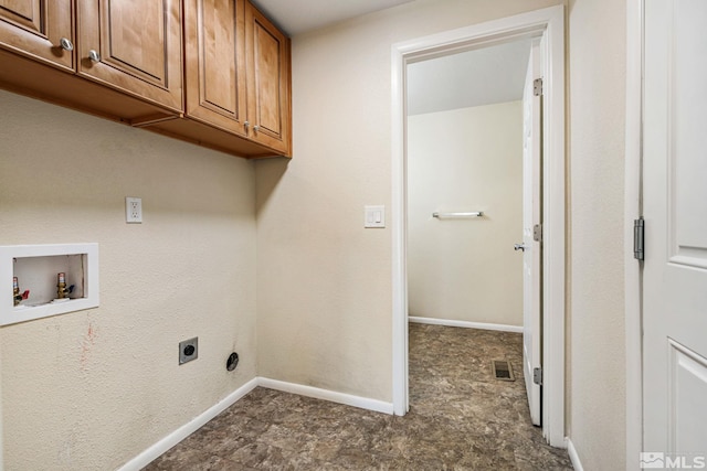 washroom featuring hookup for an electric dryer, visible vents, baseboards, hookup for a washing machine, and cabinet space