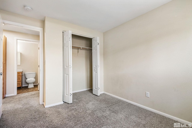 unfurnished bedroom featuring carpet, a closet, and baseboards