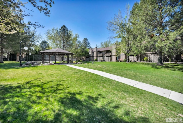 view of community with a gazebo and a yard