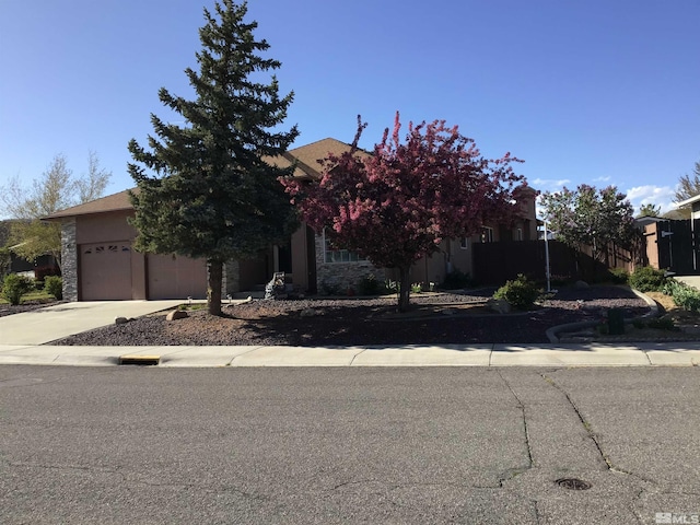 obstructed view of property with a garage and driveway