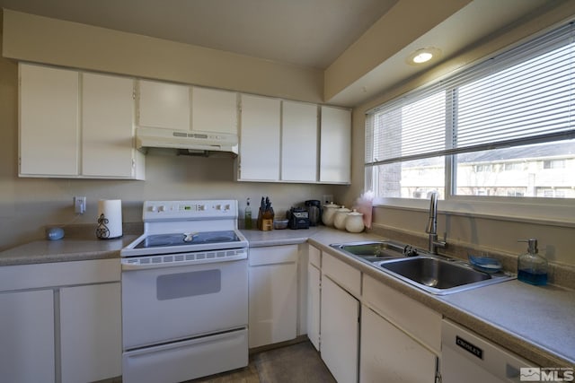 kitchen featuring under cabinet range hood, light countertops, a sink, white appliances, and white cabinetry