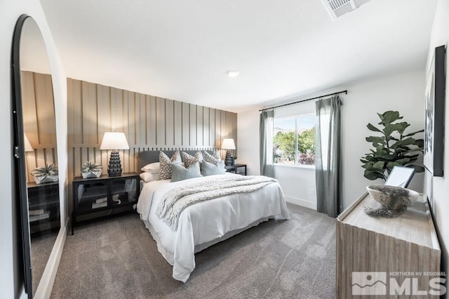 bedroom featuring visible vents, carpet flooring, and baseboards