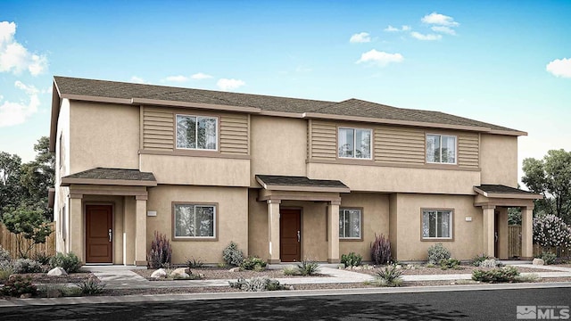 townhome / multi-family property featuring stucco siding