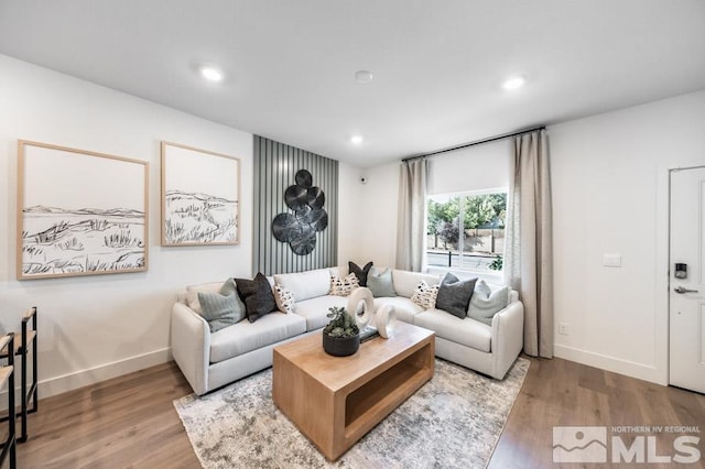 living area featuring recessed lighting, wood finished floors, and baseboards