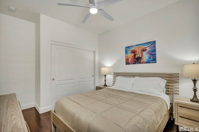 bedroom with baseboards, a closet, ceiling fan, and dark wood finished floors