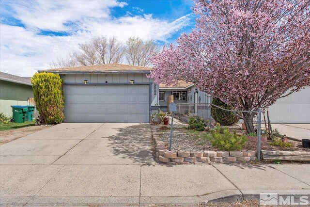 view of front of property featuring driveway and a garage