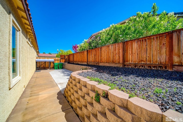 view of yard with a patio area and a fenced backyard