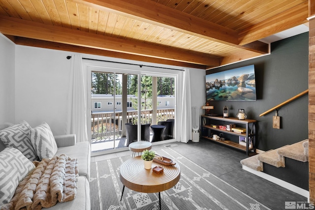 living area with stairway, beam ceiling, and wooden ceiling