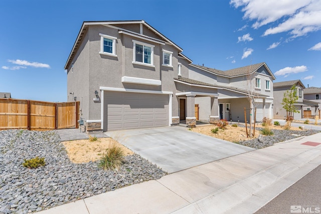 view of front facade with fence, concrete driveway, an attached garage, stucco siding, and stone siding