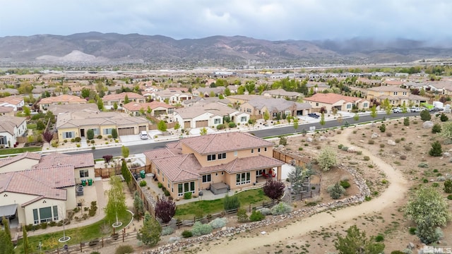 drone / aerial view with a residential view and a mountain view