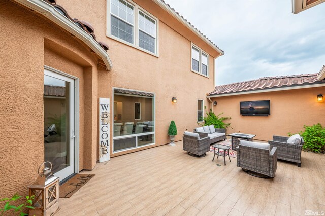 view of patio / terrace with an outdoor hangout area and a wooden deck