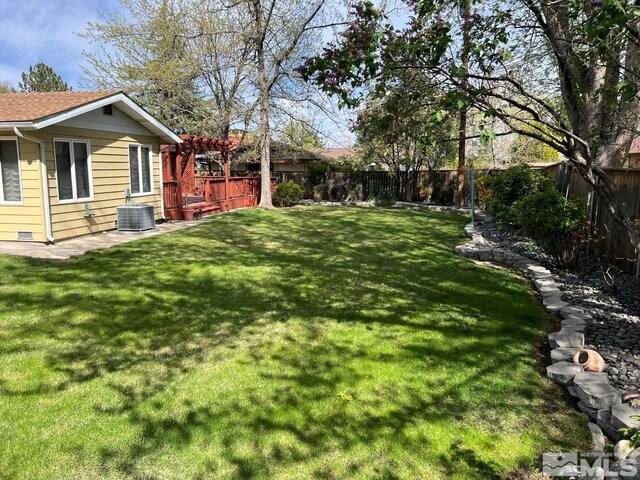 view of yard with a fenced backyard and a pergola