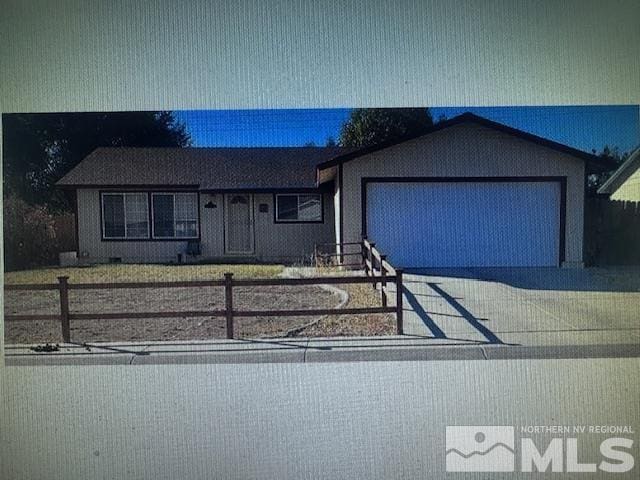 ranch-style house with a garage, a fenced front yard, and concrete driveway