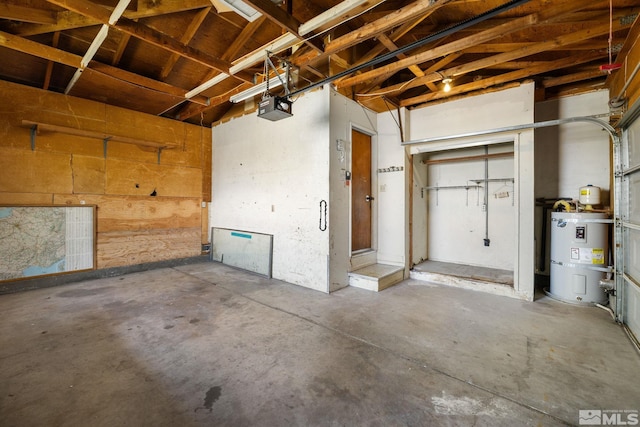 garage featuring water heater and a garage door opener