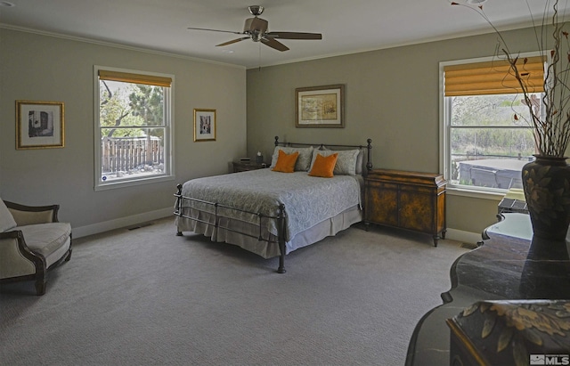 bedroom with baseboards, visible vents, ornamental molding, and carpet